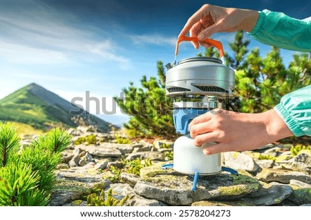 Similar – Image, Stock Photo Kettle placed on campfires in snowy woods at sundown