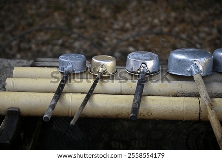 Similar – Image, Stock Photo Ladle at the garden fence converted to turn the barbecue coal