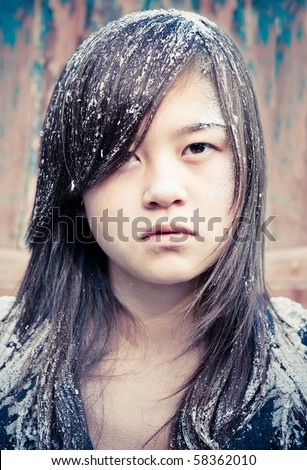 girl with head covered with ashes