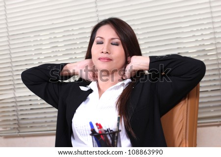 business woman holding her neck with relaxing