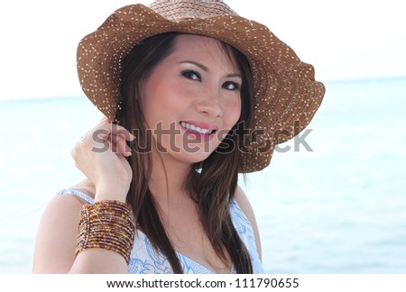 pretty girl in smiling expression on the beach