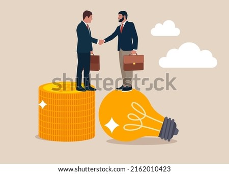 Entrepreneur standing on light bulb idea lamp shaking hands with Von money coins stack. Idea pitching, fundraising and venture capital, selling business or merger agreement concept.