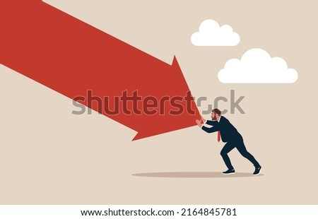 Man pushing falling down arrow with full effort. Survive investment crash, crisis or recession, pushing back or effort to win business challenge, economic recession.