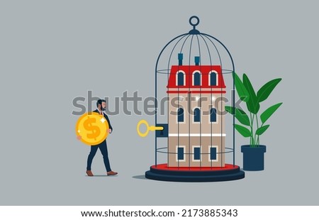 Male pay money to unlock house from cage. House inside the cage with Locked-Business and financial problems. Foto stock © 