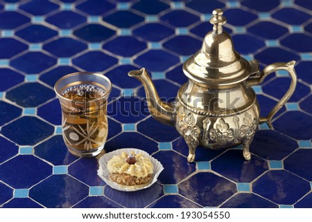 Moroccan tea and cookie on a mosaic table