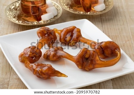 Plate with Cevizli Sucuk, Turkish Churchkhela sweets with walnuts close up Stok fotoğraf © 