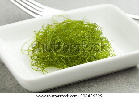 Dish with fresh filamentous green algae as a side dish