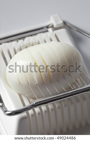 Hard boiled egg in an egg slicer