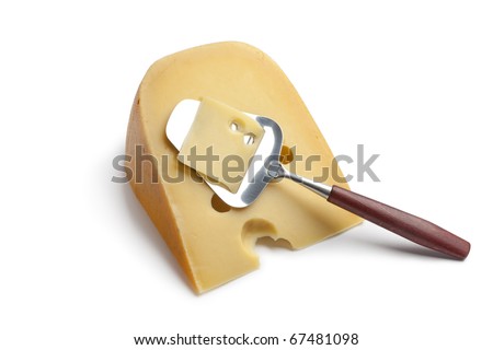 Piece of Dutch farmers cheese with a cheese-slicer on white background