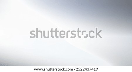 Silver foil background with metal mirror texture. Chrome gradient surface with light like could