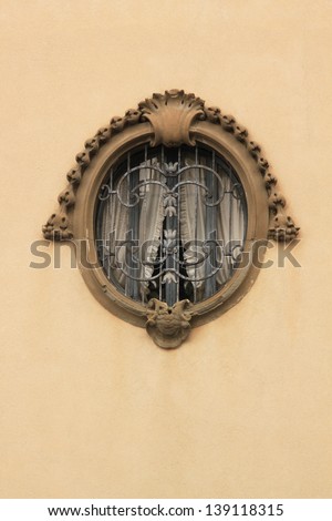 Oval window decorated with relief contour