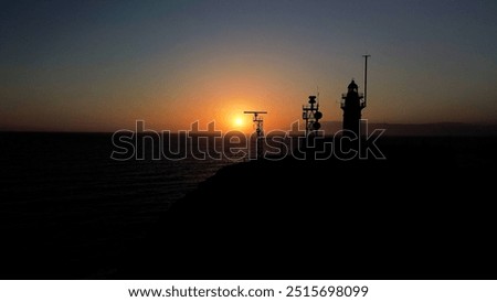 Similar – Foto Bild Einsamer Leuchtturm an felsiger Küste am Morgen