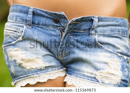 Sexy denim low-cut shorts closeup