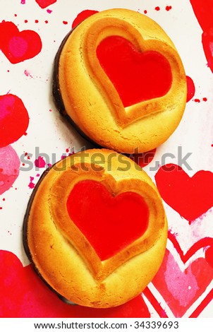Cookies with jam on tissue with hearts