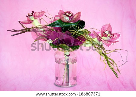 bouquet of orchids in the background