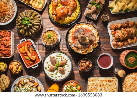 Arabic Cuisine: Middle Eastern traditional lunch. It's also Ramadan "Iftar". The meal eaten by Muslims after sunset during Ramadan. Assorted of Arabic oriental dishes. top view with close up. 