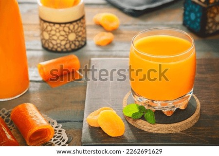Arabic Cuisine; Middle Eastern delicious apricot drink 'Qamar Al-Din'. It made from rolled dried apricot or dried apricot paste. Served in the holy month of Ramadan. Imagine de stoc © 