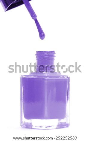 Purple nail polish bottle isolated on white background