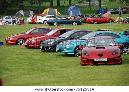 WAKEFIELD, ENGLAND - MAY 10: Red Toyota Celica with Row of Cars on Display at the Annual Rising Sun Car Show on May 10, 2008 in Wakefield, England, UK.  Norton Priory is host to the show