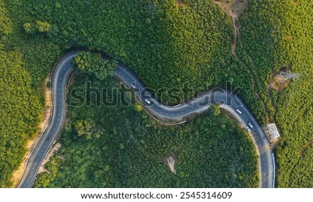 Similar – Image, Stock Photo Winding road on hilly terrain