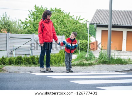 Similar – Image, Stock Photo Mother and son crossing a bridge together