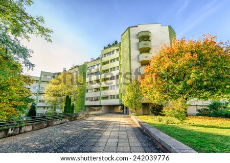 Modern apartment building with autumn colored trees
