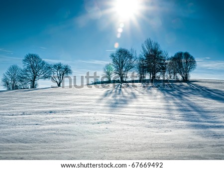 Sun over snowy Hill