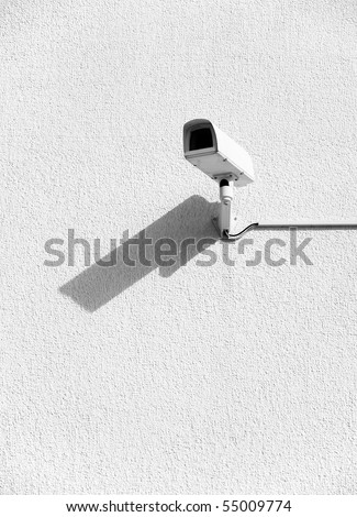 Video surveillance cameras on a wall.