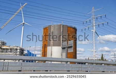 Similar – Image, Stock Photo Power poles in front of evening sky, taken through a power pole in the foreground, cropped, orange-black