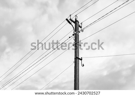 Similar – Image, Stock Photo An old wooden power pole and power lines, bushes and sky