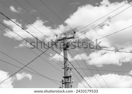 Similar – Image, Stock Photo An old wooden power pole and power lines, bushes and sky