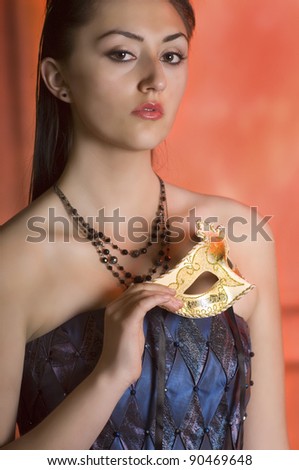 Young Teen woman at Masquerade Ball with long dark hair