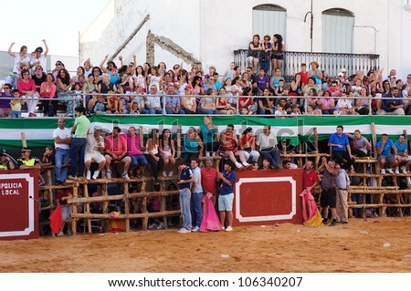 SAN JUAN, HUELVA, SPAIN - JUNE 23: The festival of St. John the Baptist\'s. Running of the Bulls of San Juan is the most popular celebration in Andalusia on June 23, 2012 in San Juan, Huelva, Spain.