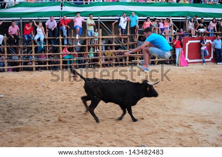 SAN JUAN, HUELVA, SPAIN - JUNE 23: The festival of St. John the Baptist\'s. Running of the Bulls of San Juan is the most popular celebration in Andalusia on June 23, 2013 in San Juan, Huelva, Spain
