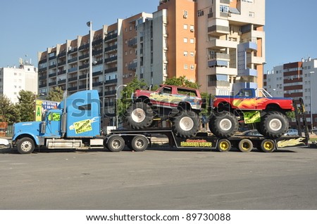 HUELVA, ANDALUSIA, SPAIN - JULY 21: Freestyle Motor truck show. A popular monster truck, is on display before a performance at stadium area at plaza de toros on July 21, 2011 in Huelva, Spain.