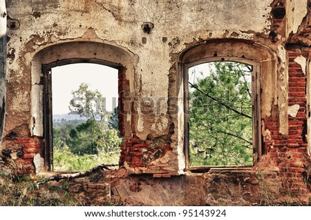 Two old windows on old dirty wall