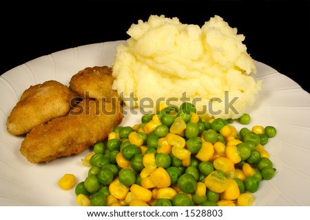 Dinner crumbed chicken and peas corn