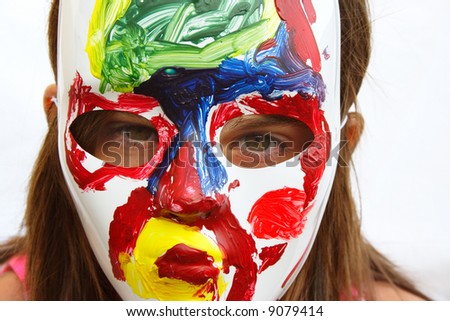 Girl wearing painted mask