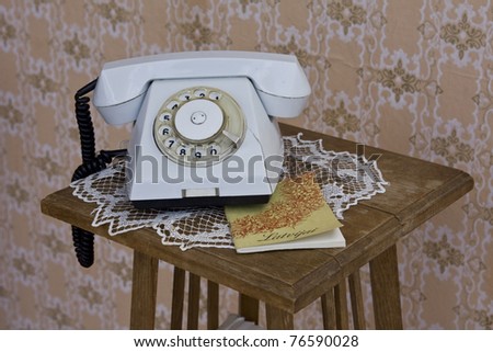Old made in USSR rotary phone on table