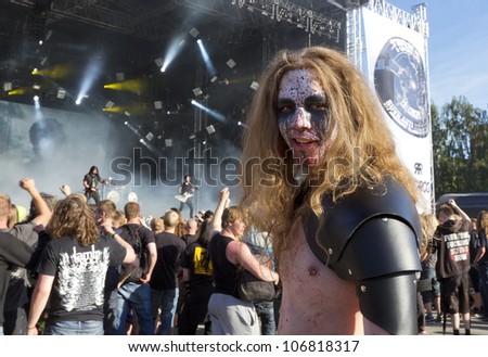 HELSINKI, FINLAND - JUNE 29: Unidentified Fans at gig of american heavy metal band Trivium June 29, 2012 at 15th annual Tuska Open Air Metal Festival in Suvilahti, in Helsinki, Finland.