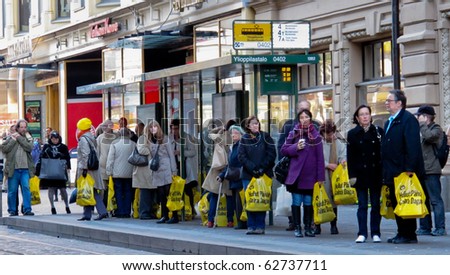 HELSINKI,FINLAND-OCTOBER 6: Department store Stockmann's biannual event from 1986 Crazy Days sales is very popular,yellow plastic bags fills the city in Finland on October 6, 2010 in Helsinki,Finland