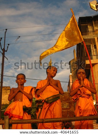 VARANASI, INDIA - SEPTEMBER 17: Young Hindu monks worship on the banks of the Ganges River on September 17, 2008 in Varanasi, India.