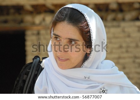 BAHARAK, AFGHANISTAN - JUNE 1: Female aid worker listens intently at a village meeting on June 1, 2010 in Baharak, Afghanistan. She is supporting a women\'s weaving co-operative.
