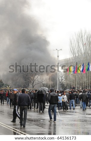 BISHKEK, KYRGYZSTAN - APRIL 7: Protesters gather and set fire to cars in Ala Too Sqaure on April 7, 2010 in Bishkek, Kyrgyzstan. This was the first day of the country\'s revolution.