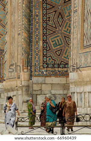 SAMARKAND, UZBEKISTAN - MAY 21: Women come to pray at the Registan on May 21, 2010 in Samarkand, Uzbekistan. Unusually, both women and men have full access to all areas of the mosques and madrassas.