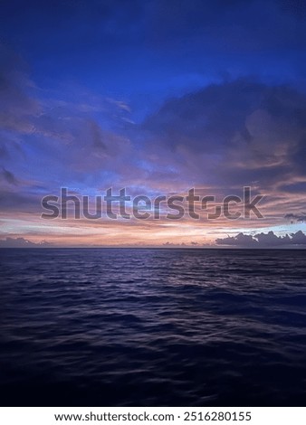 Similar – Image, Stock Photo Sunset on Thursday Island. In the golden glow, the water shines. In front a group of trees and behind a small island with passage to the sea.