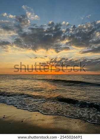 Similar – Image, Stock Photo sunset over the baltic sea, portrait of a young woman standing on the beach