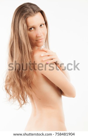 Young beautiful woman with perfect body touching her smooth silky breast skin after shower. Skincare Sexy fit naked woman with healthy clean skin sitting, isolated on ...