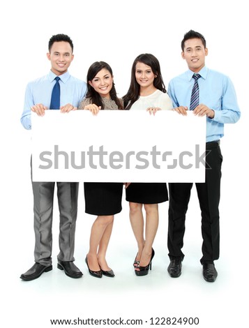 Portrait of young business team holding a big blank card