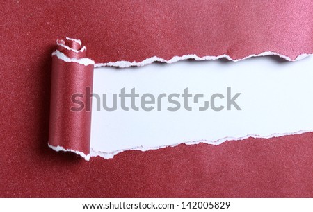 ripped red color paper over white background